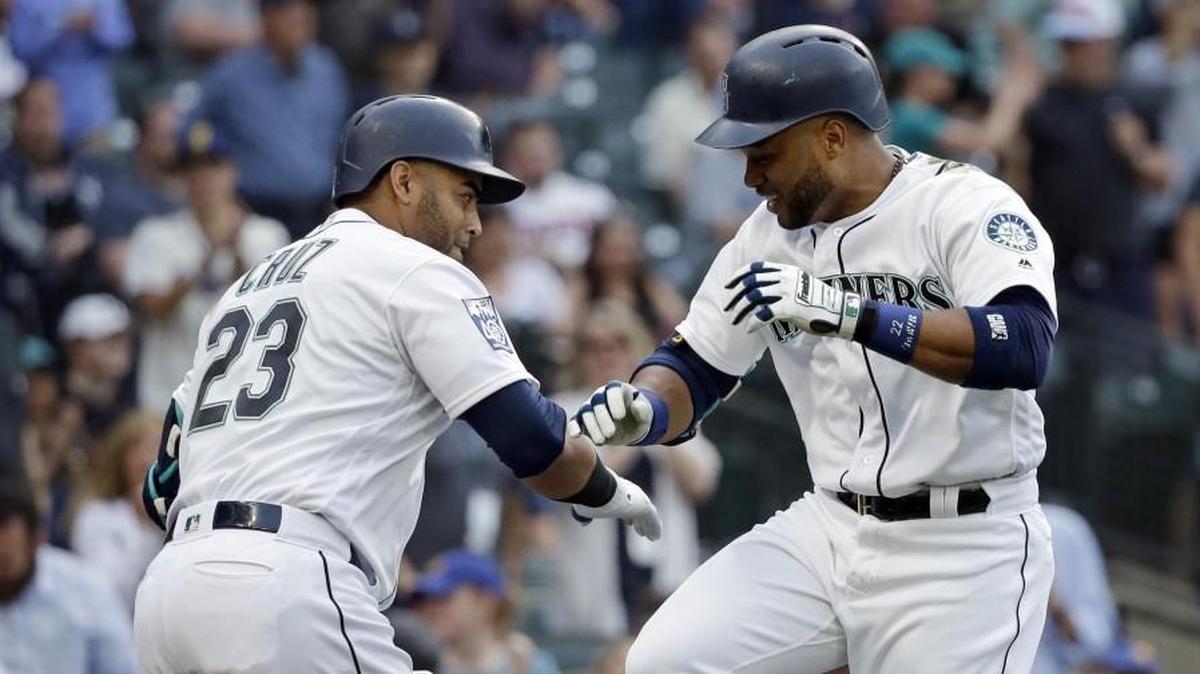 Seattle Mariners' Robinson Cano, right, is congratulated on his home run by Nelson Cruz, left. Cano and Cruz are the anchors of a Seattle Mariners batting order, that with the additions of Dee Gordon and Ryon Healy, could be potent.