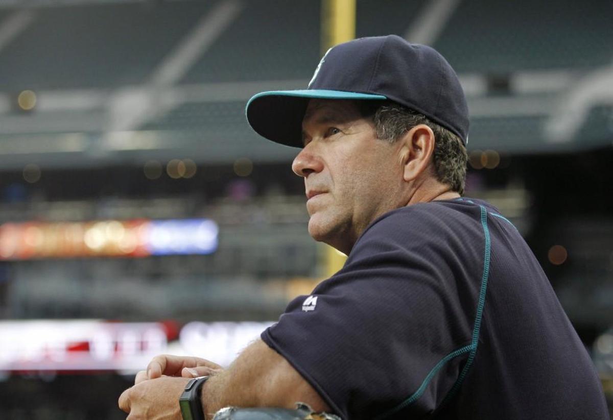 Seattle Mariners batting coach Edgar Martinez watches from the dugout during a baseball game against the Los Angeles Angles on Friday, July 10, 2015, in Seattle.