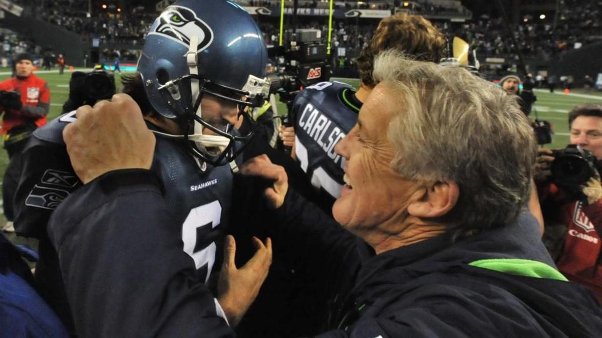 Seattle Seahawk coach Pete Carroll celebrates with quarterback Charlie Whitehurst after the win over the Rams on January 2, 2011. The vicotry propelled the Seahawks to the first playoff berth of the Carroll era.