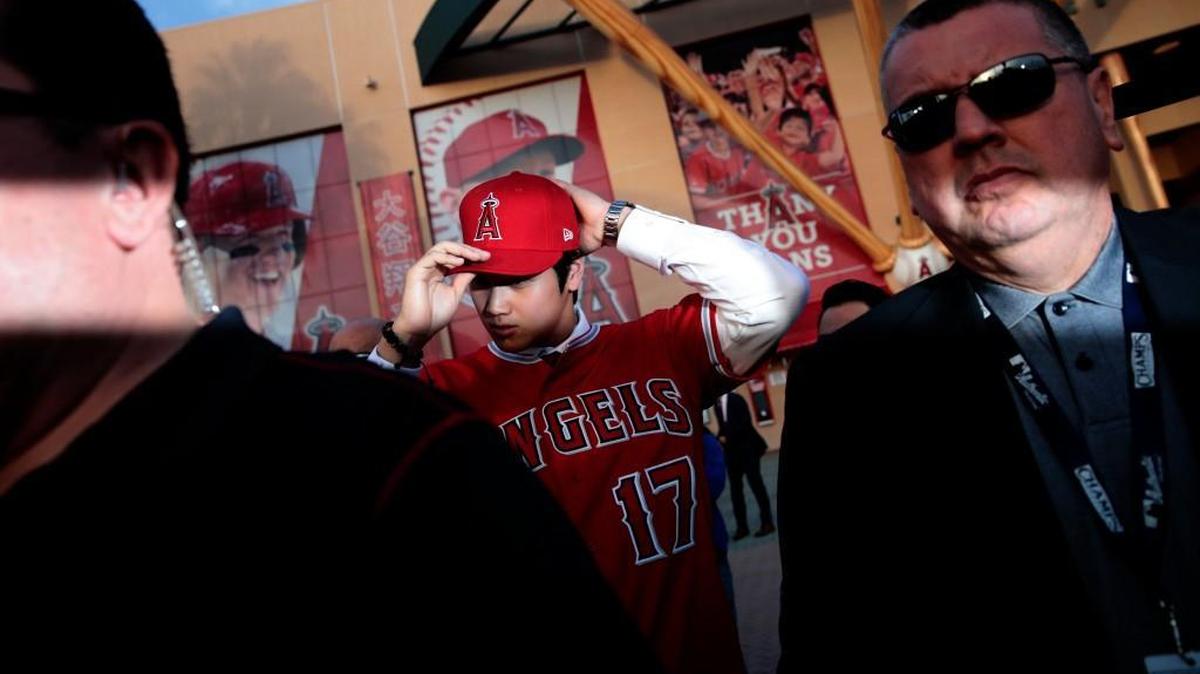 Shohei Ohtani puts on his hat after a news conference, outside Angel Stadium on Dec. 9, 2017, in Anaheim, Calif. The Mariners went all-in on Ohtani, with GM Jerry Dipoto arranging trades to deepen the team’s pool of signing money for international players in exchange for prospects from what’s considered a barren farm system. The effort didn’t translate into a positive result, but it was an inspired effort.