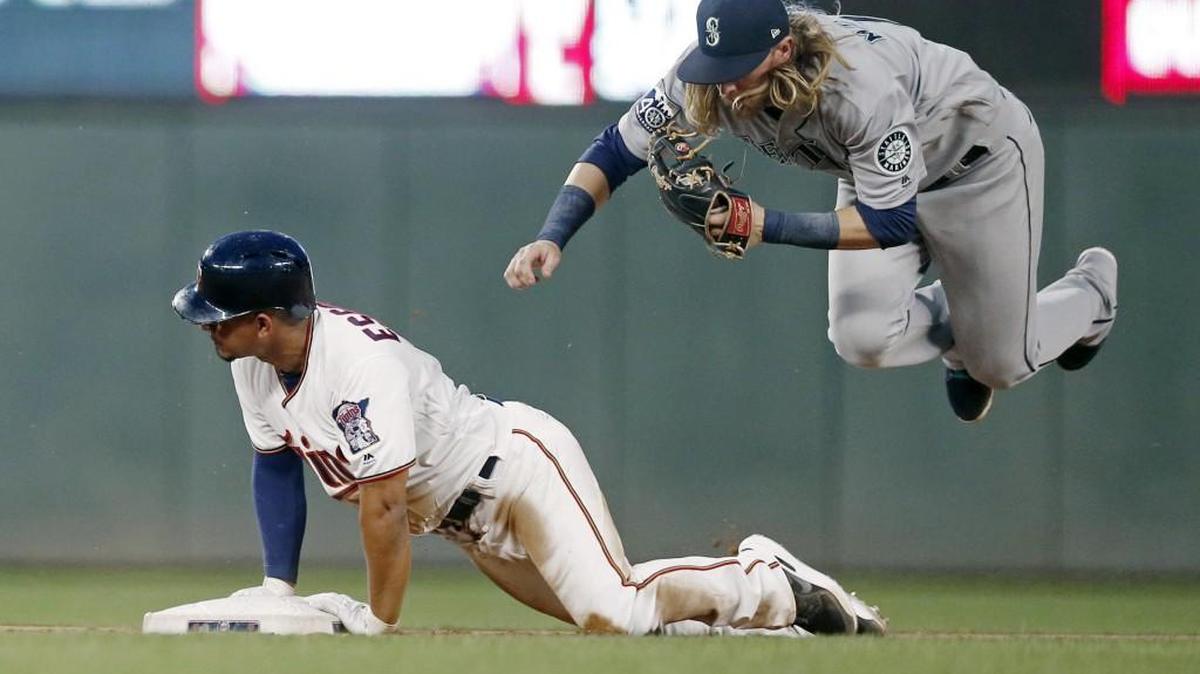 The Mariners Taylor Motter, right, tags out the Twins' Eduardo Escobar in Minneapolis back in June. Could a similar play – but this time at Safeco Field – happen in the playoffs?