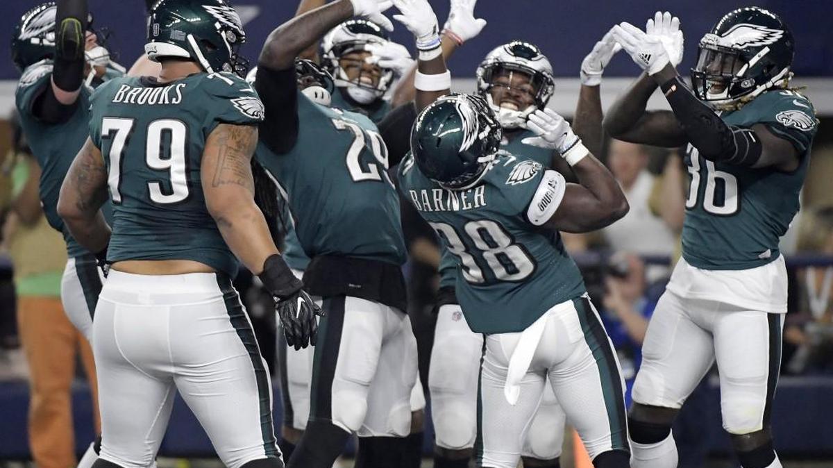 Philadelphia Eagles running back Kenjon Barner (38) and his team celebrate his first quarter touchdown against the Dallas Cowboys last week.