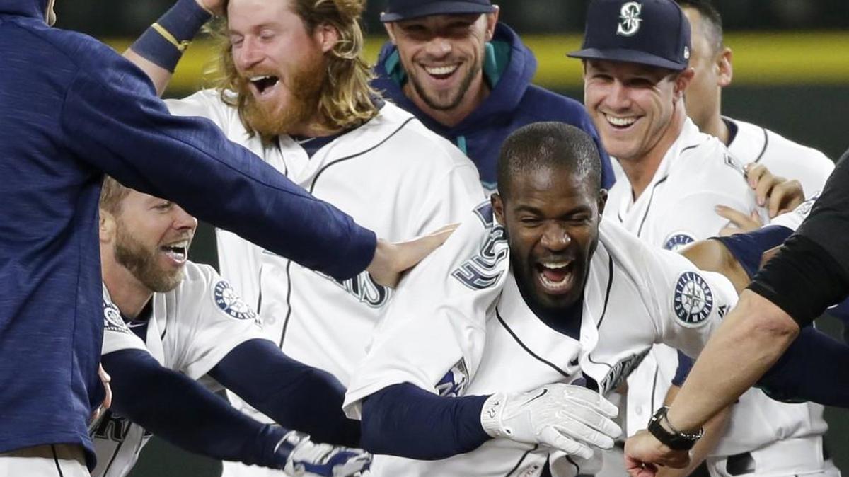 Seattle Mariners' Guillermo Heredia, center, and teammates had plenty to celebrate after a win over the Chicago White Sox earlier this season. Will they have even more to be excited about in October?