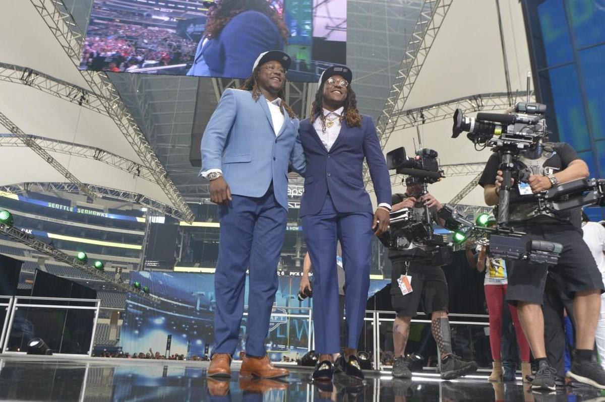 The Seattle Seahawks selected UCF linebacker Shaquem Griffin, left, joining his twin brother Shaquill on the team, in the fifth round, 141st overall, during the final day of the 2018 NFL Draft at AT&T Stadium in Arlington, Texas, on Saturday, April 28, 2018.