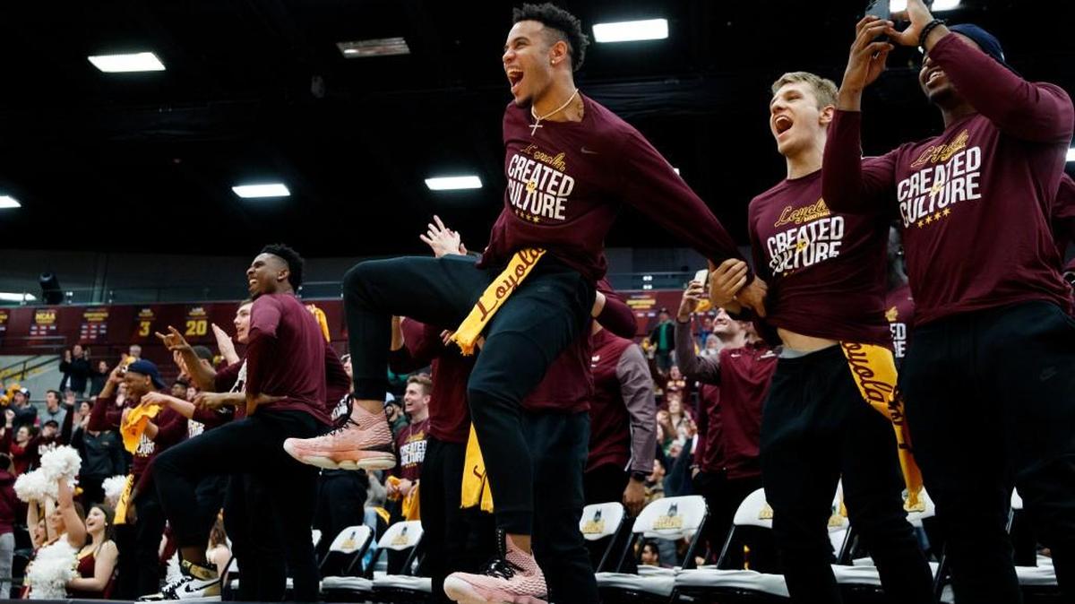 Loyola Ramblers guard Marques Townes, center, celebrates with other Loyola men’s basketball players after the team was selected to play in the NCAA Tournament during a selection show watch party at Gentile Arena on Sunday in Chicago.