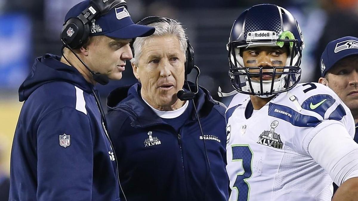 Seattle Seahawks offensive coordinator Darrell Bevell, head coach Pete Carroll and quarterback Russell Wilson talk strategy against the Denver Broncos during the NFL Super Bowl 49 that ended with the Seahawks’ winning their first – and so far only – championship.