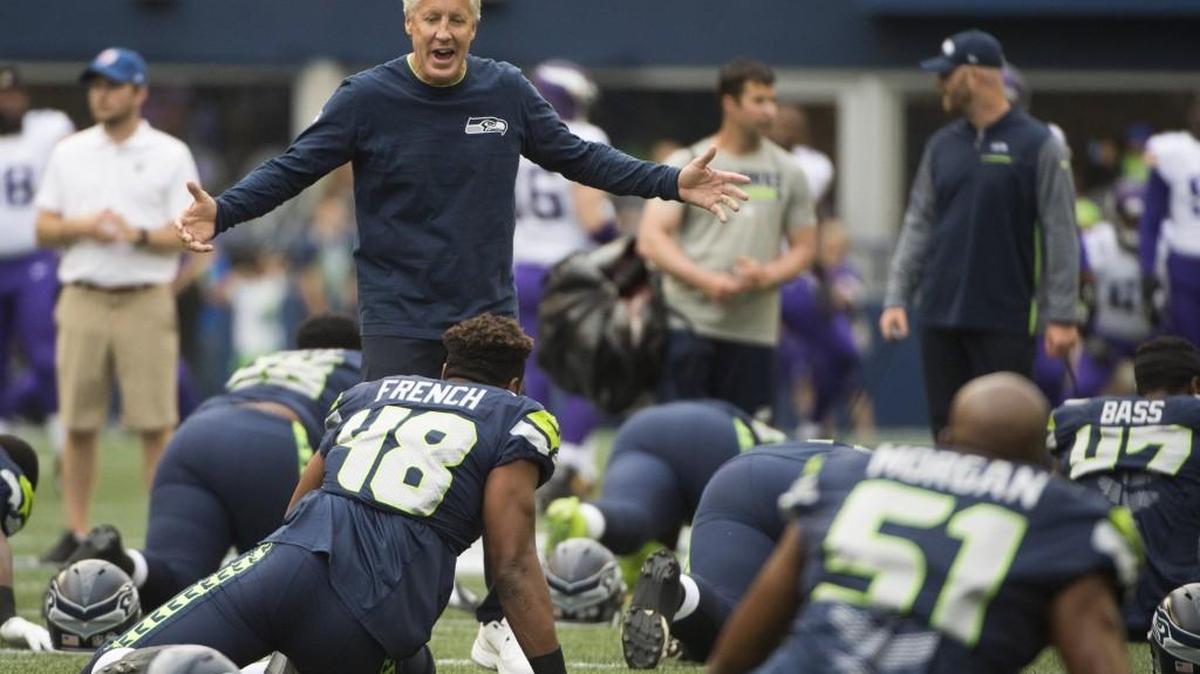 Seahawks coach Pete Carroll, talking with players during warmups before an exhibition game in August, learned from his days at USC that the game at hand is what matters.