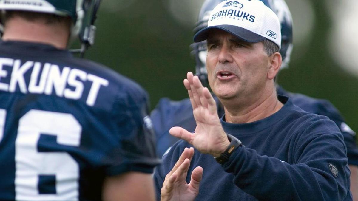 Seattle Seahawks offensive line coach Mike Solari, right, previously worked for Mike Holmgren and Jim Mora.