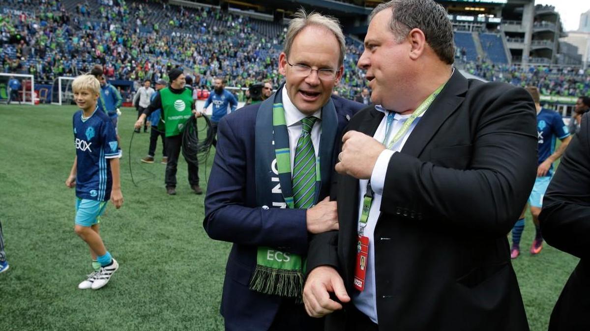 Seattle Sounders head coach Brian Schmetzer, left, chats with general manager Garth Lagerwey at CenturyLink Field. Lagerwey’s infusion of younger players this season has helped Schmetzer and the Sounders get back to the MLS Cup.