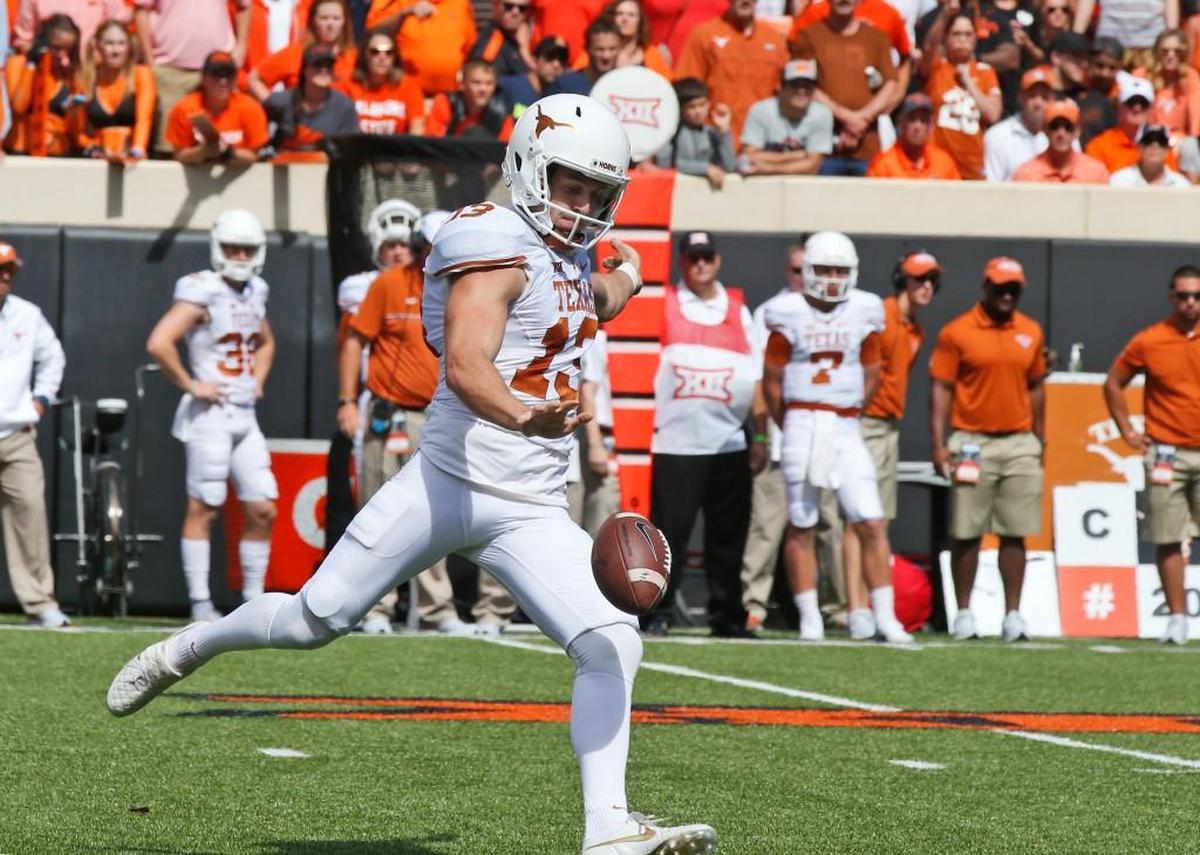 Texas punter Michael Dickson (13) kicks against Oklahoma State in Stillwater, Okla. Punters typically aren’t drafted, and when they are, it’s in the sixth or seventh round. Hawks general manager John Schneider thought enough of Michael Dickson to arrange a trade and move up in the fifth round to get him.