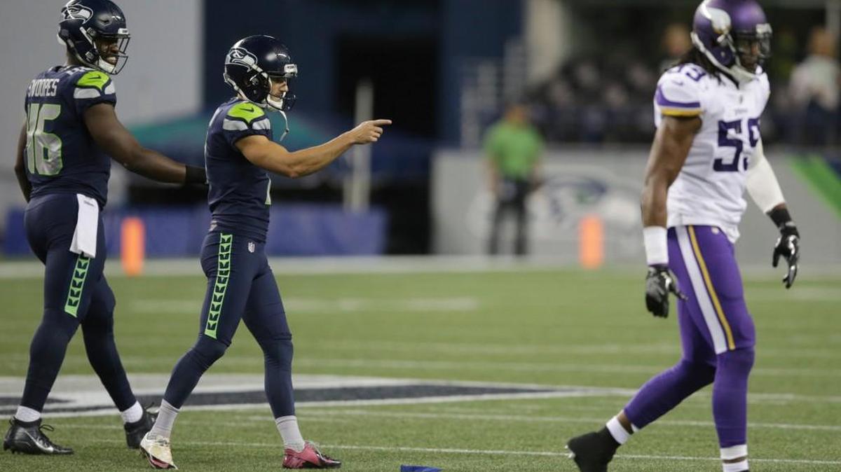 Seattle kicker Blair Walsh, second from left, points toward the Minnesota bench after he kicked a field goal Friday during the second half in Seattle. The Seahawks won 20-13.