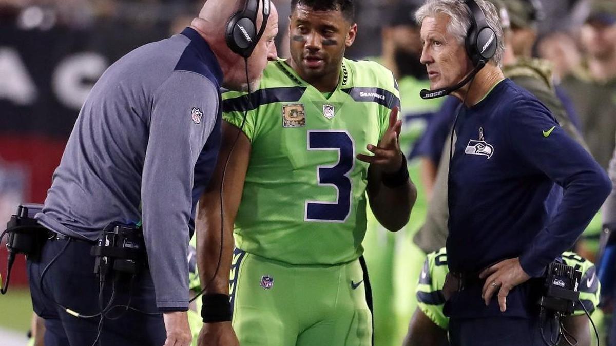 If the Seahawks are going to get back to the playoffs, head coach Pete Carroll, right, and assistant head coach Tom Cable will have to rely on quarterback Russell Wilson to get them there.