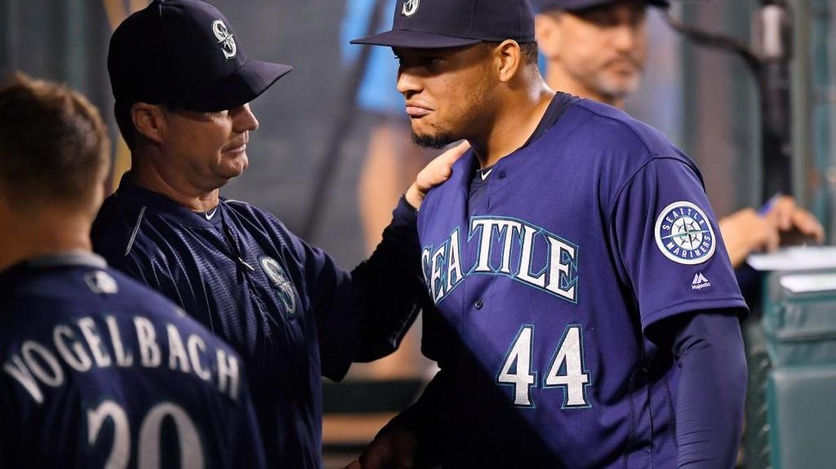 Mariners manager Scott Servais, center, talks with starting pitcher Taijuan Walker last season. The 24-year-old, hard-throwing Walker was traded, along with young shortstop Ketel Marte, to Arizona for shortstop Jean Segura and a pair of prospects this past Wednesday.