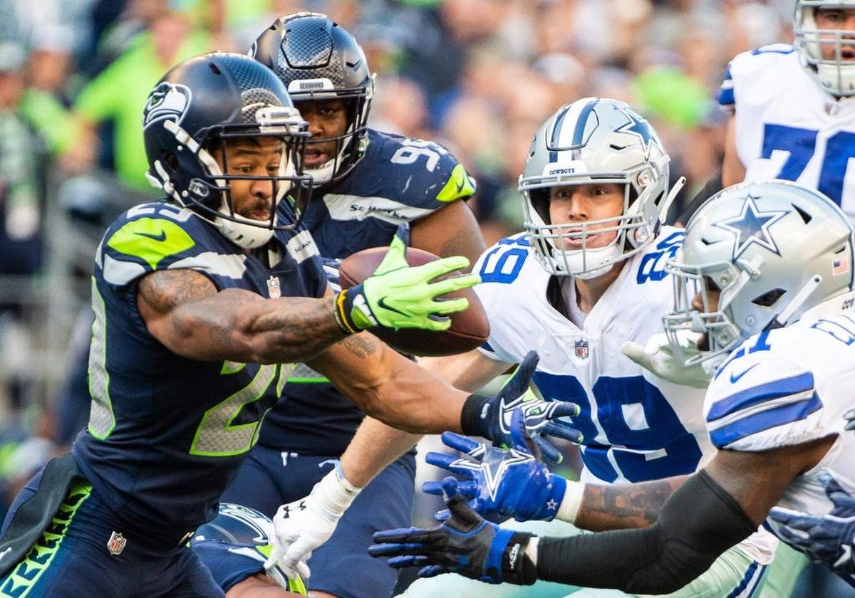 Seahawks safety Earl Thomas intercepts a tipped pass in the fourth quarter. The Seattle Seahawks played the Dallas Cowboys in a NFL football game at CenturyLink Field in Seattle, Wash., on Sunday.
