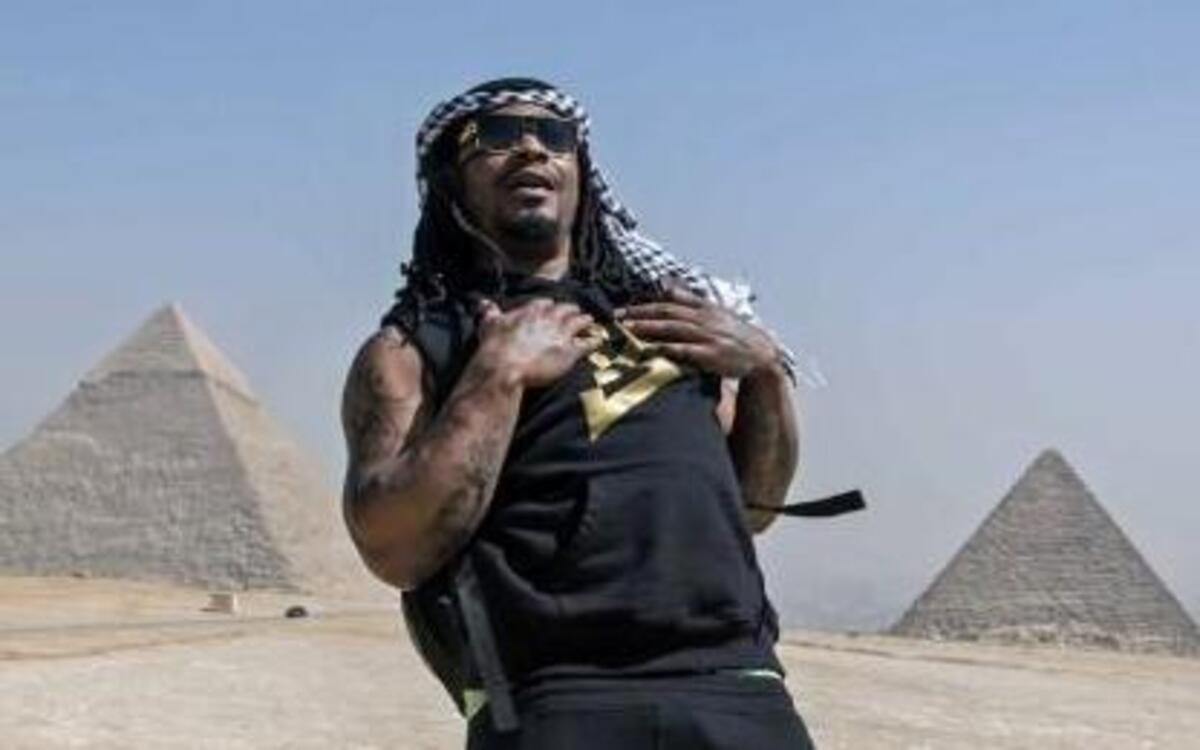 Former Seattle Seahawks running back Marshawn Lynch, left, visits the Pyramids of Giza, in Cairo, Egypt, in February. Lynch retired from the NFL earlier this year.