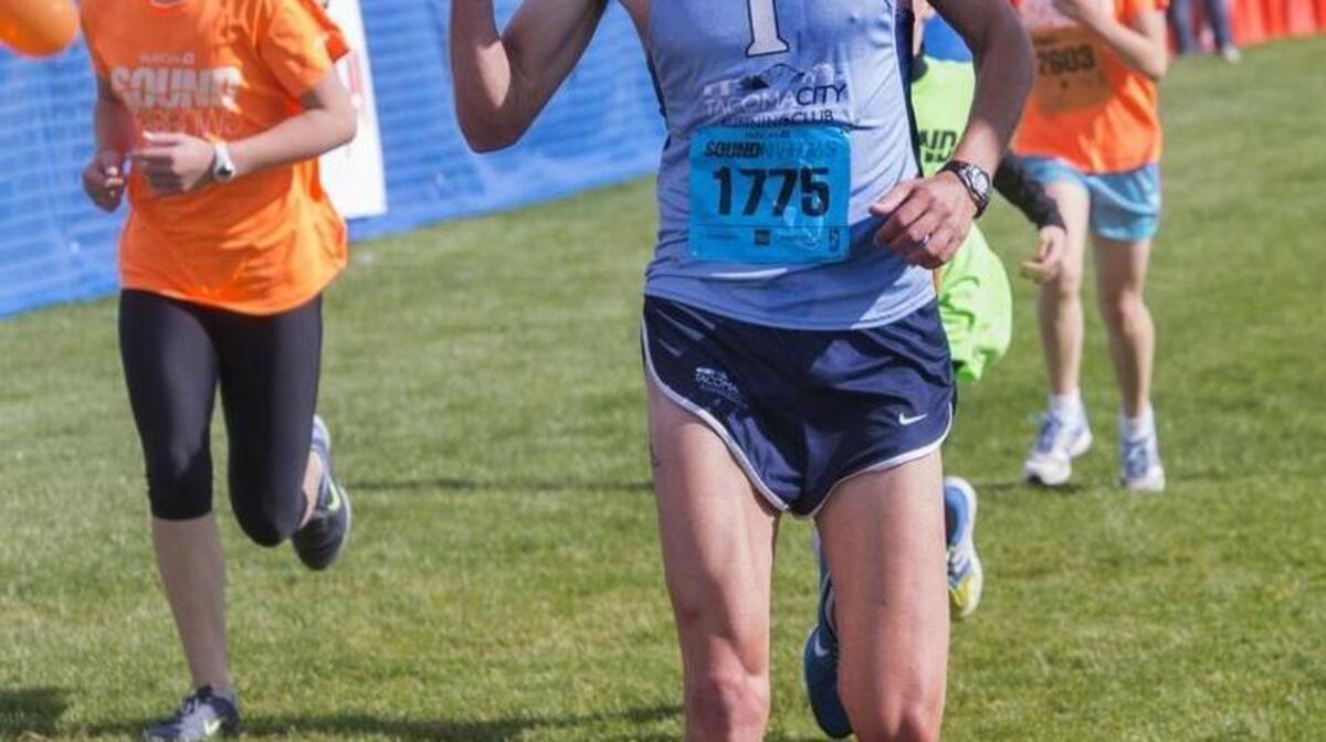 Greg Leak of Tacoma pumps his fist as he captures his first Sound to Narrows 12K title. Leak competes for Tacoma City Running Club and finished with a time of 38:31.