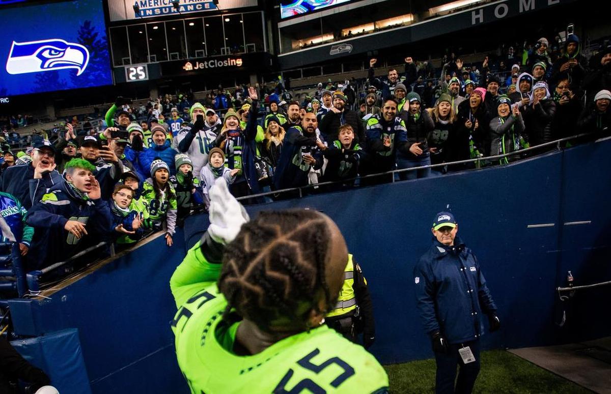 Seahawks defensive lineman Frank Clark listens for the crowd to cheer after Monday night’s win over the Minnesota Vikings, in which Clark starred yet again.