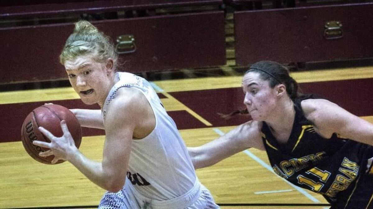 Puget Sound’s Alexis Noren flies pass Pacific Lutheran’s Kaelyn Voss for two points in a 70-48 home win for UPS on Jan. 26. Noren is in the Northwest Conference’s top 10 in scoring, rebounding, assists, steals and field goal percentage.