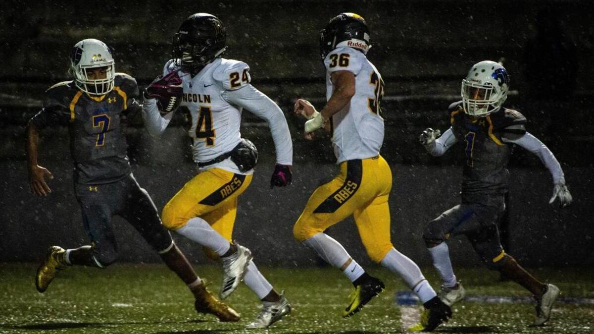 Lincoln’s Julien Simon (24) returns an interception for a touchdown in the first quarter. Stadium high school played Lincoln high school in a football game at the Stadium Bowl in Tacoma, Wash., on Friday, Oct. 5, 2018.