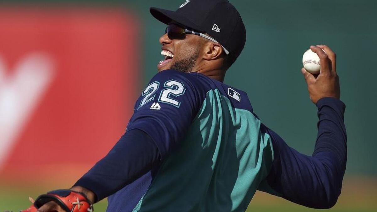 Seattle Mariners’ Robinson Cano smiles as he warms up during batting practice prior to the baseball game against the Oakland Athletics Tuesday, Aug. 14, 2018, in Oakland, Calif. Robinson Cano is set to return after an 80-game drug suspension. The All-Star second baseman last played May 15. Seattle is 1 1/2 games behind Oakland for the second AL wild card. (AP Photo/Ben Margot)
