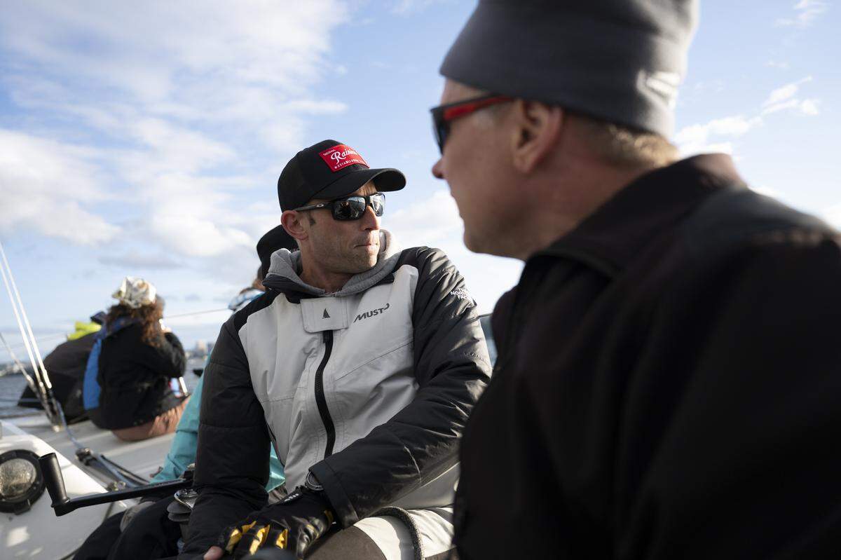 Rick Donohue, left, and Skipper Brian White of Grace E navigate the scrum of boats during The Corinthian Yacht Club of Tacoma Late Spring Windseekers #1 race on Commencement Bay, on Wednesday, May 13, 2026, in Tacoma.
