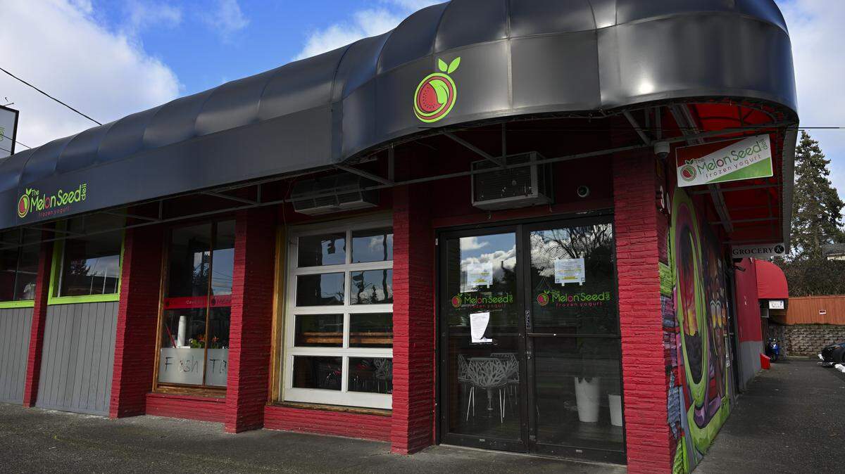 Melon Seed Deli has been open since 2013, known for sliders and frozen yogurt. It was closed Feb. 18 by the Washington Department of Revenue over thousands of dollars in tax debt. A sign posted in the window announces the revocation of the business’s reseller permit on Wednesday, Feb. 25, 2026, in Tacoma, Wash.