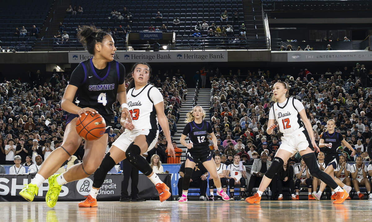 Sumner guard Kawehi Borden (4) dribbles to the net against Davis during the Girls 4A State Tournament Championship at the Tacoma Dome, on Saturday, March 7, 2026, in Tacoma, Wash.