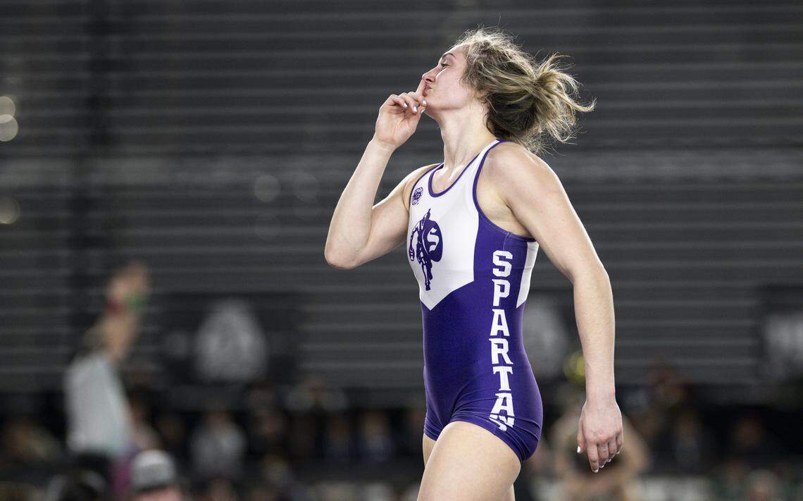 Sumner’s Saige McCleery reacts to beating Kentwood’s Yula Vi in the Girls 4A 140-pound Championship match during the Mat Classic XXXVII at the Tacoma Dome, on Friday, Feb. 20, 2026, in Tacoma, Wash.