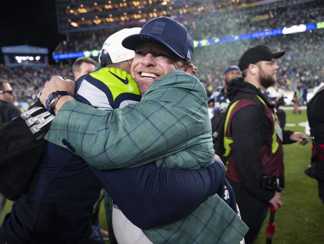 Seattle Seahawks general manager John Schneider hugs Seattle Seahawks running back Kenneth Walker III (9) after beating the New England Patriots 29-13 in Super Bowl LX at Levi's Stadium on Sunday, Feb. 8, 2026, in Santa Clara, Calif.