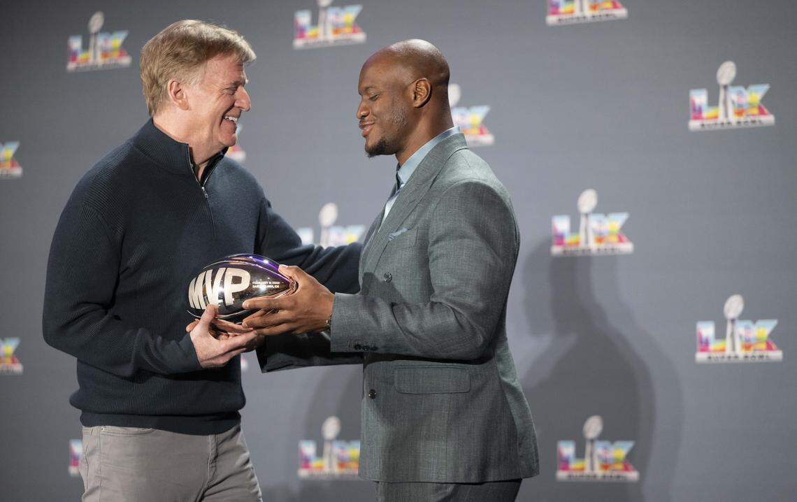 NFL Commissioner Roger Goodell hands Seattle Seahawks running back Kenneth Walker III (9) the Super Bowl MVP trophy during a press conference after winning Super Bowl LX at Moscone Center on Feb. 8, 2026 in San Fransisco.