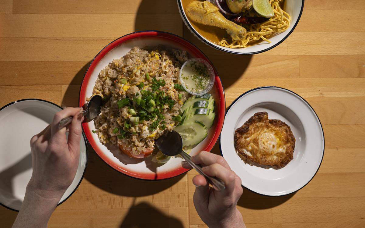 The crab fried rice sings with the lime-garlic vinegar, a condiment favored with Thai seafood.
