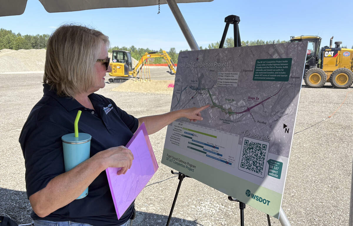 Kris Olsen, WSDOT Communications Manager for the Puget Sound Gateway Program gestures to a map of the of the SR 167 Completion Project, on Wednesday, July. 15, 2026, in Fife.