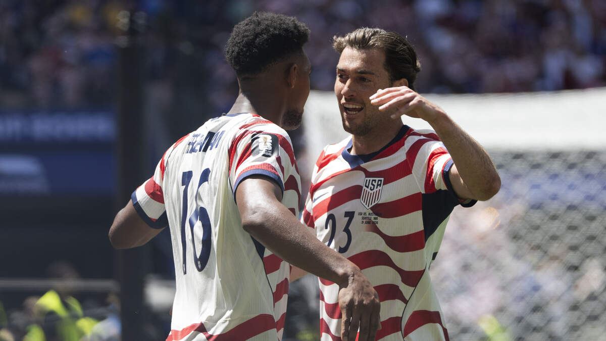 United States of America defender Alex Freeman (16) and defender Joe Scally (23) hug during the second half of FIFA World Cup 2026 Group D match against Australia at Seattle Stadium, on Friday, June 19, 2026, in Seattle.