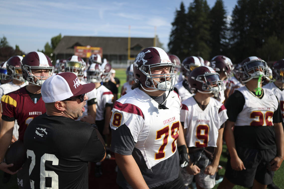 South Sound prep football players practicing on the field during the summer heat
