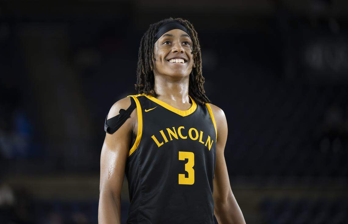 Lincoln guard Davion Shareef-Dulanacy (3) smiles at the free throw line after hearing Eastside Catholic Yabi Aklog (5) was ejected for a technical during the semifinal round of the 3A State Tournament at the Tacoma Dome, on Friday, March 6, 2026, in Tacoma, Wash.