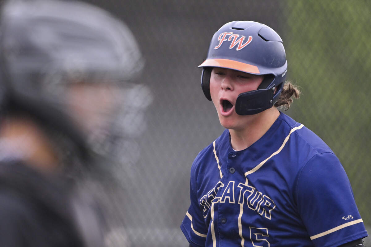 Decatur's Ethan Flavel (5) reacts to his grand slam against Shorewood during the opening round of the 3A state baseball tournament at Auburn High School, on Saturday, May 23, 2026, in Auburn.