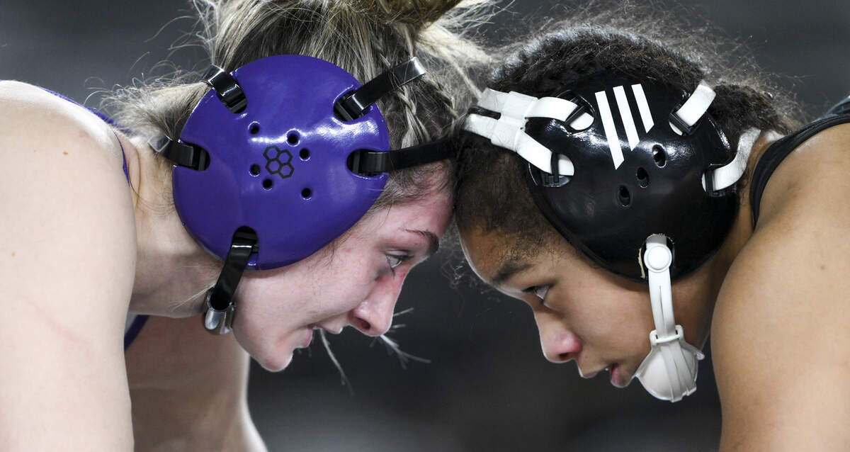 Sumner’s Saige McCleery and Kentwood’s Yula Vi head wrestle in the Girls 4A 140-pound Championship match during the Mat Classic XXXVII at the Tacoma Dome, on Friday, Feb. 20, 2026, in Tacoma, Wash.