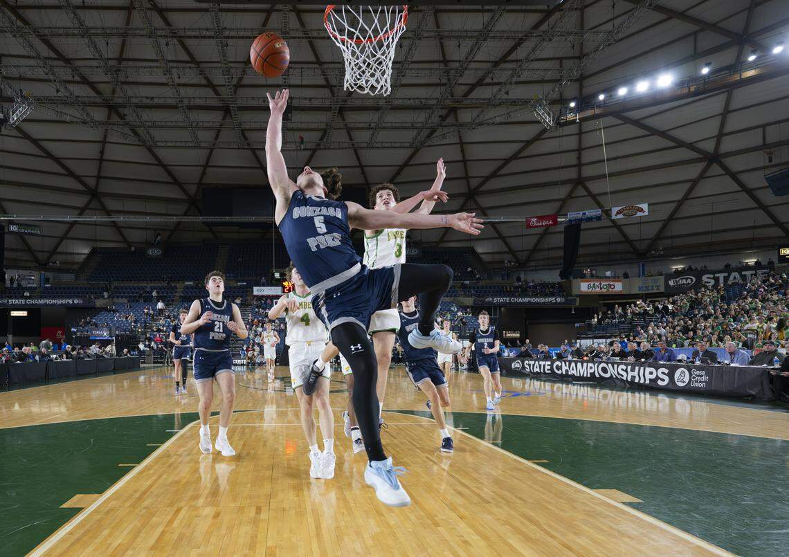 Gonzaga Prep Bullpups guard Jack Pierce (5) goes for the lay up against Richland during the Boys 4A State Tournament Championship at the Tacoma Dome, on Saturday, March 7, 2026, in Tacoma, Wash.