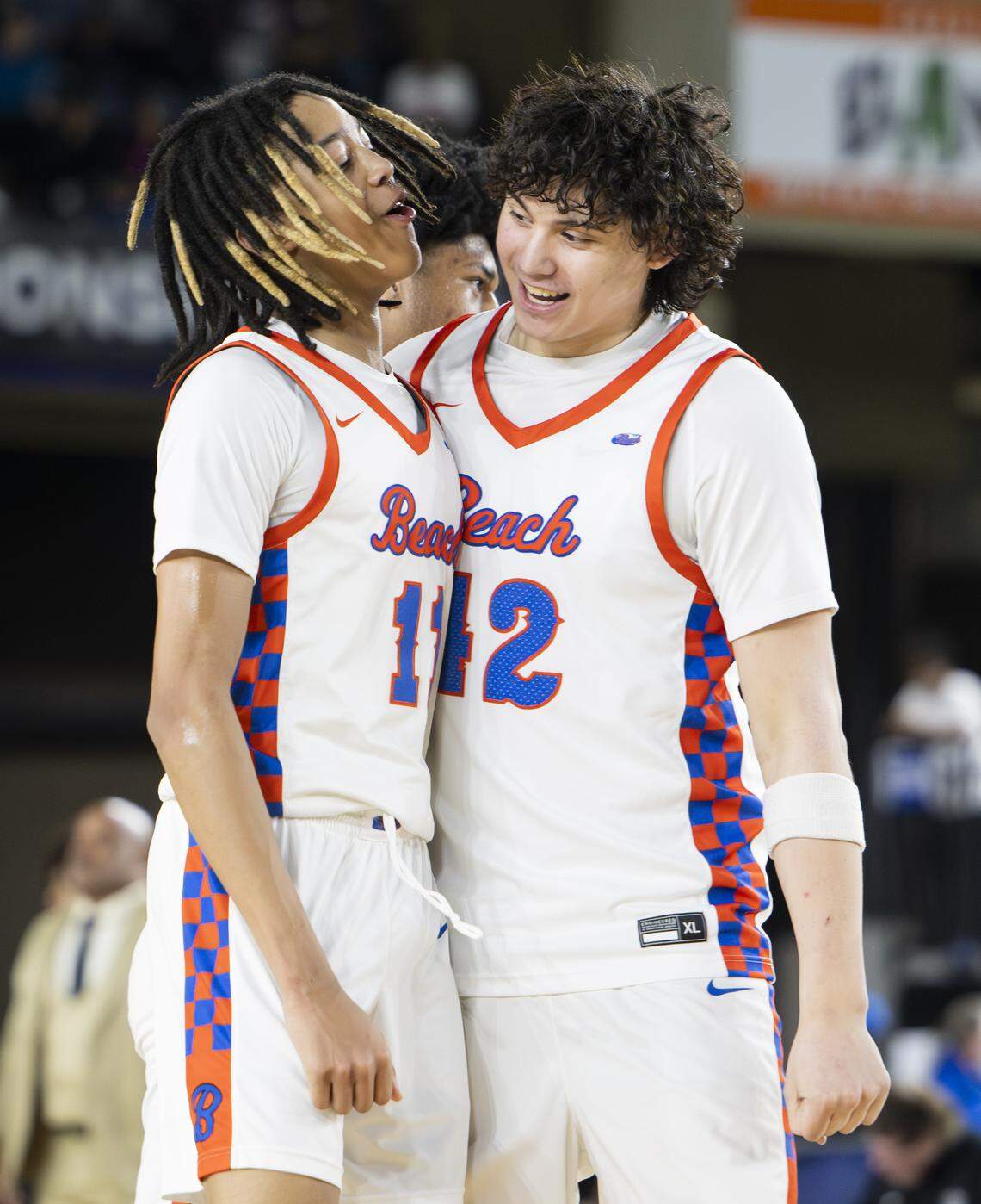 Rainier Beach guard JJ Crawford (11) reacts to a three point basket against Lincoln during the Boys 3A State Tournament Championship at the Tacoma Dome, on Saturday, March 7, 2026, in Tacoma, Wash.