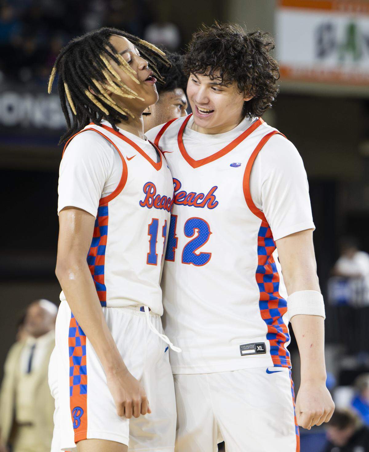 Rainier Beach guard JJ Crawford (11) reacts to a three point basket against Lincoln during the Boys 3A State Tournament Championship at the Tacoma Dome, on Saturday, March 7, 2026, in Tacoma, Wash.