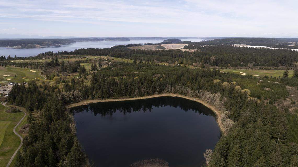 As DuPont eyes new lakeside trails, will they be on the hook for toxic soil?