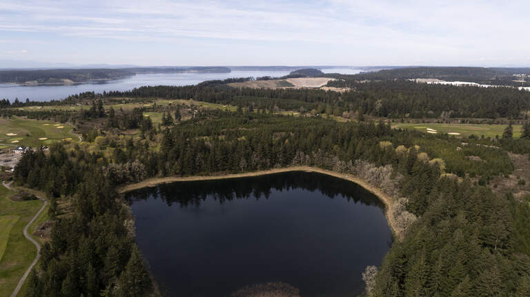 As DuPont eyes new lakeside trails, will they be on the hook for toxic soil?