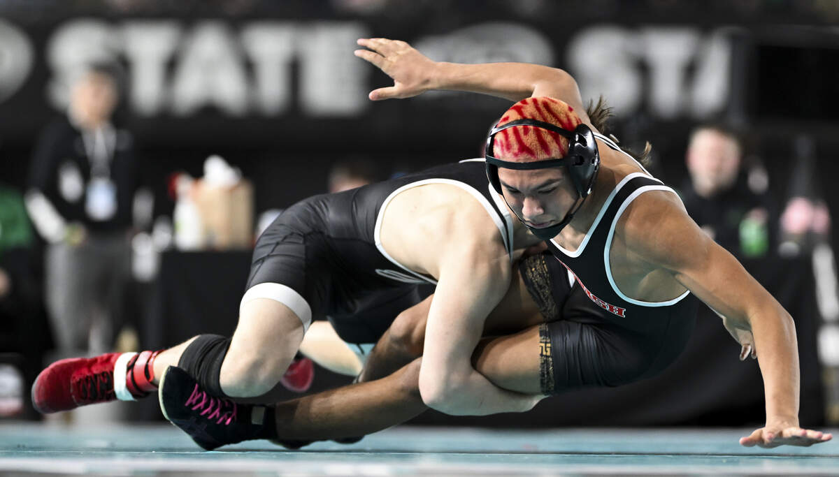 Orting’s Dakota Anderson takes down Toppenish’s Isaiah Rios in the Boys 2A 150-pound Championship match during the Mat Classic XXXVII at the Tacoma Dome, on Saturday, Feb. 21, 2026, in Tacoma, Wash.