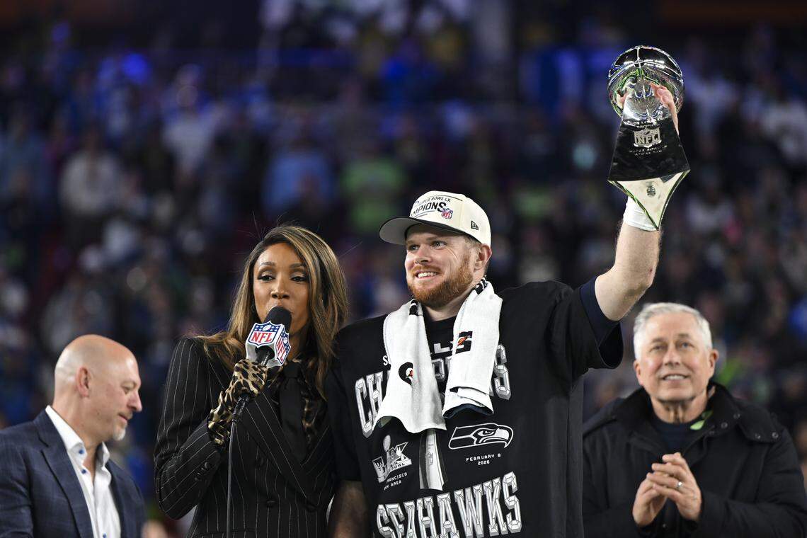Seattle Seahawks quarterback Sam Darnold (14) holds up the Lombardi Trophy after beating the New England Patriots 29-13 in Super Bowl LX at Levi's Stadium on Sunday, Feb. 8, 2026, in Santa Clara, Calif.
