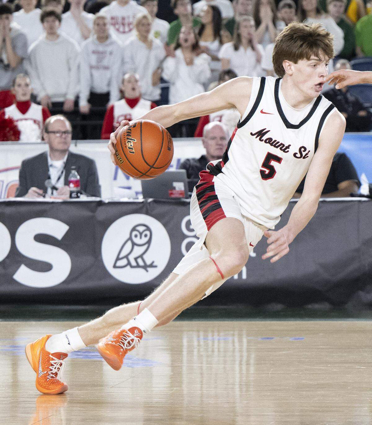 Mount Si guard Brady Hennig (5) dribbles during the quarterfinal round of the 4A State Tournament against Emerald Ridge at the Tacoma Dome, on Thursday, March 5, 2026, in Tacoma, Wash.