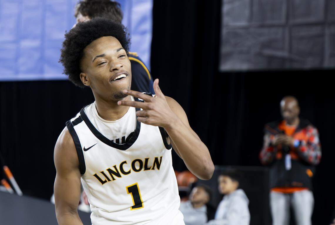 Lincoln guard O’Shea Lamar (1) reacts to sinking a three point basket against Bellevue during the quarterfinal round of the 3A State Tournament at the Tacoma Dome, on Thursday, March 5, 2026, in Tacoma, Wash.