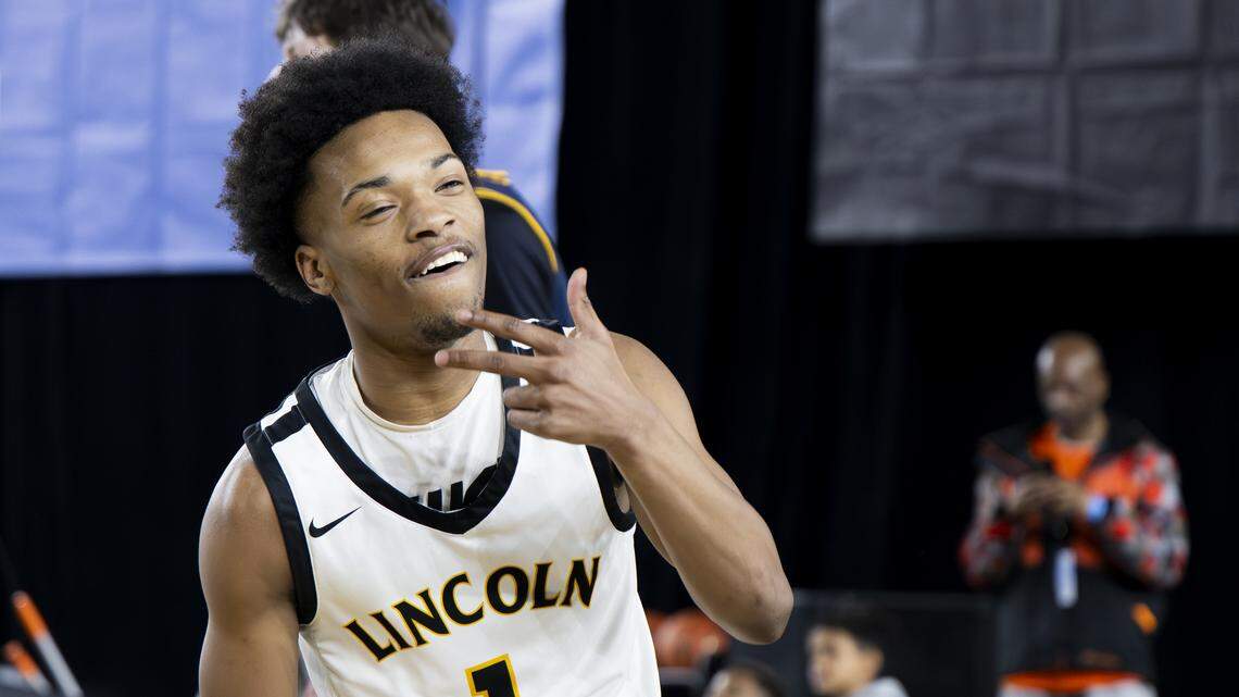 Lincoln guard O’Shea Lamar (1) reacts to sinking a three point basket against Bellevue during the quarterfinal round of the 3A State Tournament at the Tacoma Dome, on Thursday, March 5, 2026, in Tacoma, Wash.