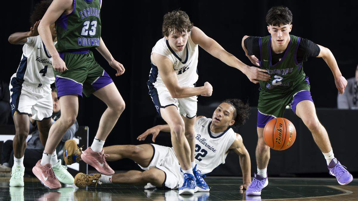 Edmonds-Woodway guard Andreas Simonsen (2) and Bellarmine Prep forward Birk Johnston (12) go for the ball during the quarterfinal round of the 3A State Tournament at the Tacoma Dome, on Thursday, March 5, 2026, in Tacoma, Wash.