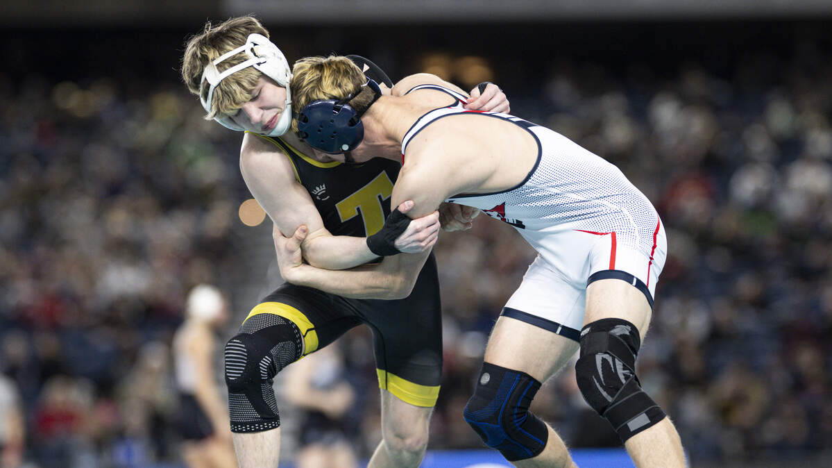 Tahoma’s Owen Marshall goes for the outside hip against Eisenhower’s Jarek Dobbie in the Boys 4A 132-pound Championship match during the Mat Classic XXXVII at the Tacoma Dome, on Friday, Feb. 20, 2026, in Tacoma, Wash.