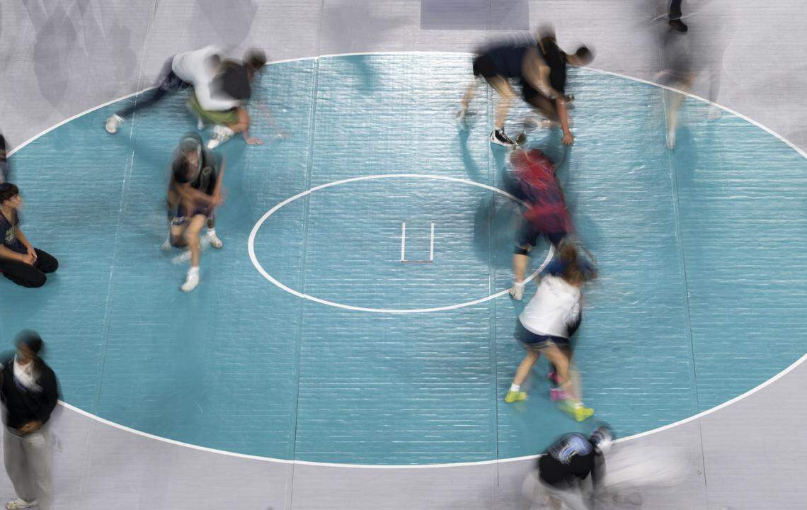Boys and Girls wrestlers in the 3A and 4A warm up during the Mat Classic XXXVII at the Tacoma Dome, on Friday, Feb. 20, 2026, in Tacoma, Wash.